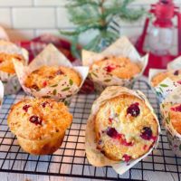 Cooling Rack full of baked Cranberry Orange Muffins.