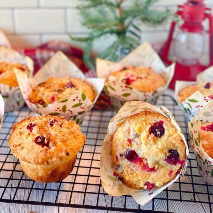 Cooling Rack full of baked Cranberry Orange Muffins.