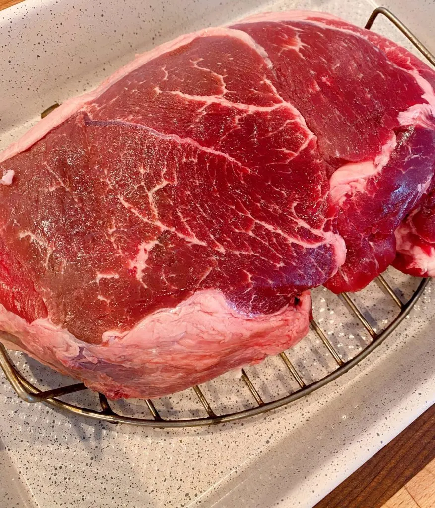 Cross Rib Roast on a roasting rack in a roasting pan.