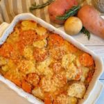 Rosemary Three-potato gratin in baking dish on cutting board.