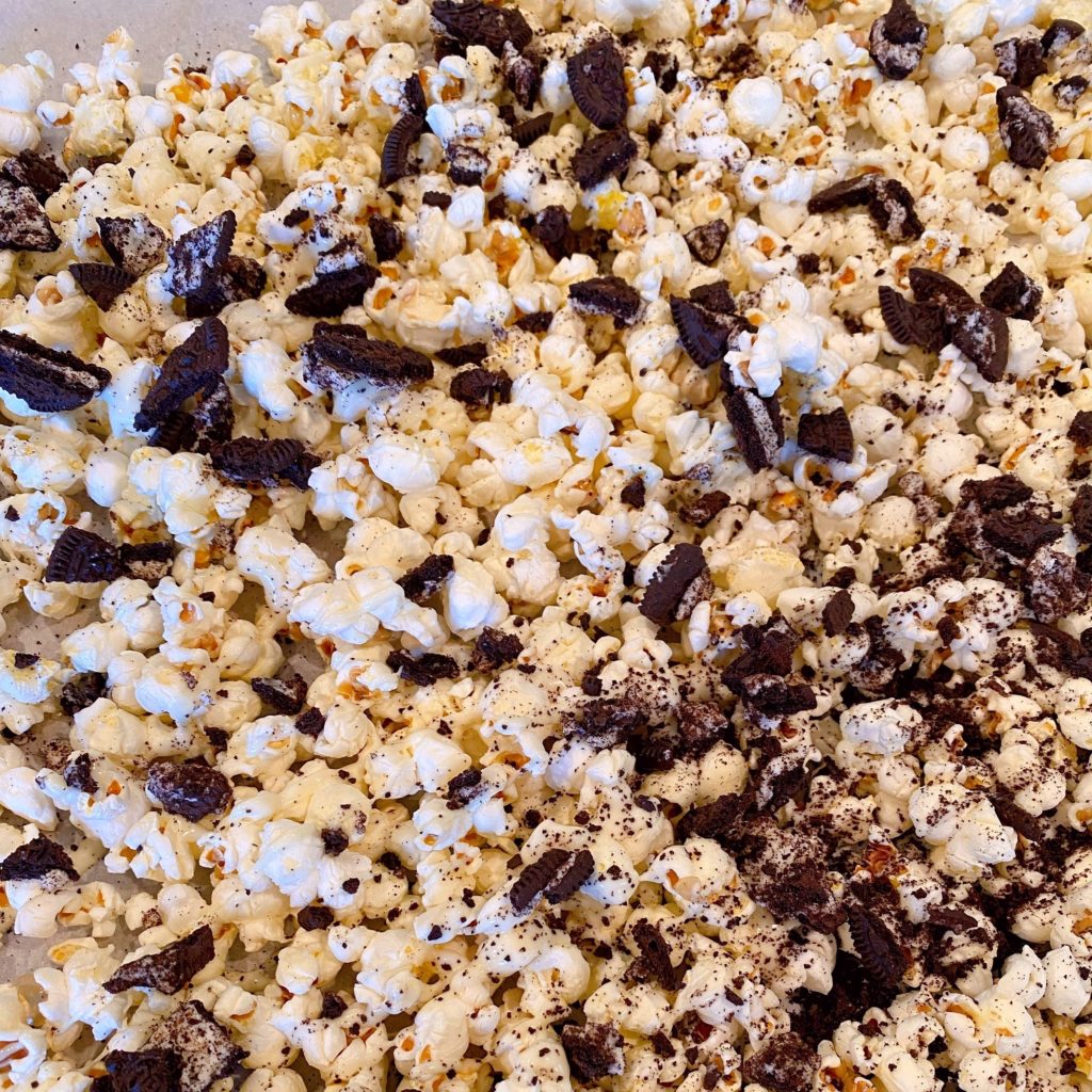 Cookies and cream poured over popped popcorn.