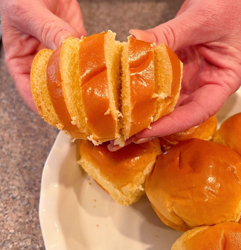 Brioche Bun sliced hasselback style and fanned out to show the slices.