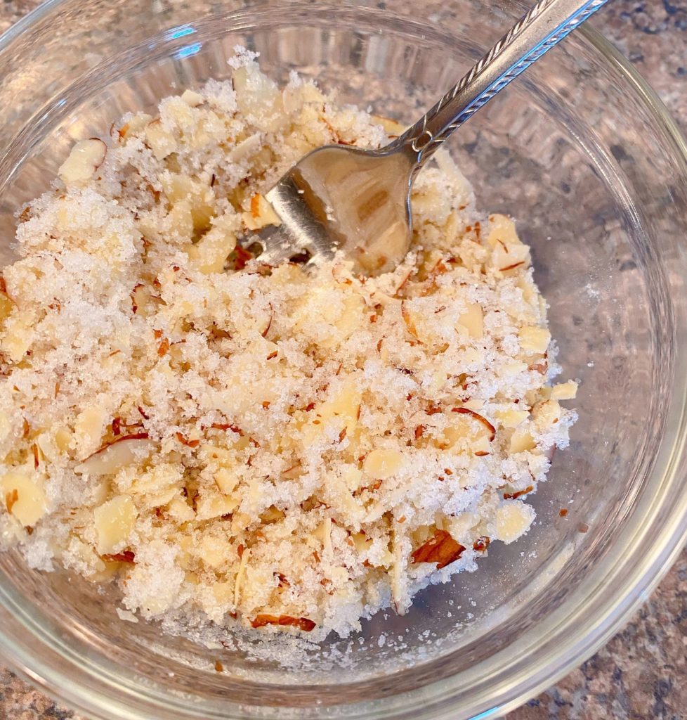 Streusel In glass bowl mixed with a fork.