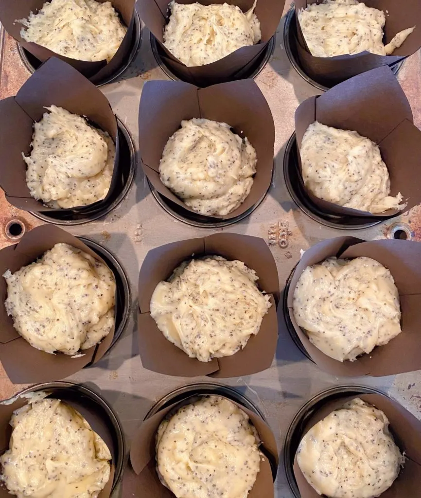 Muffin tin liners filled with muffin batter.