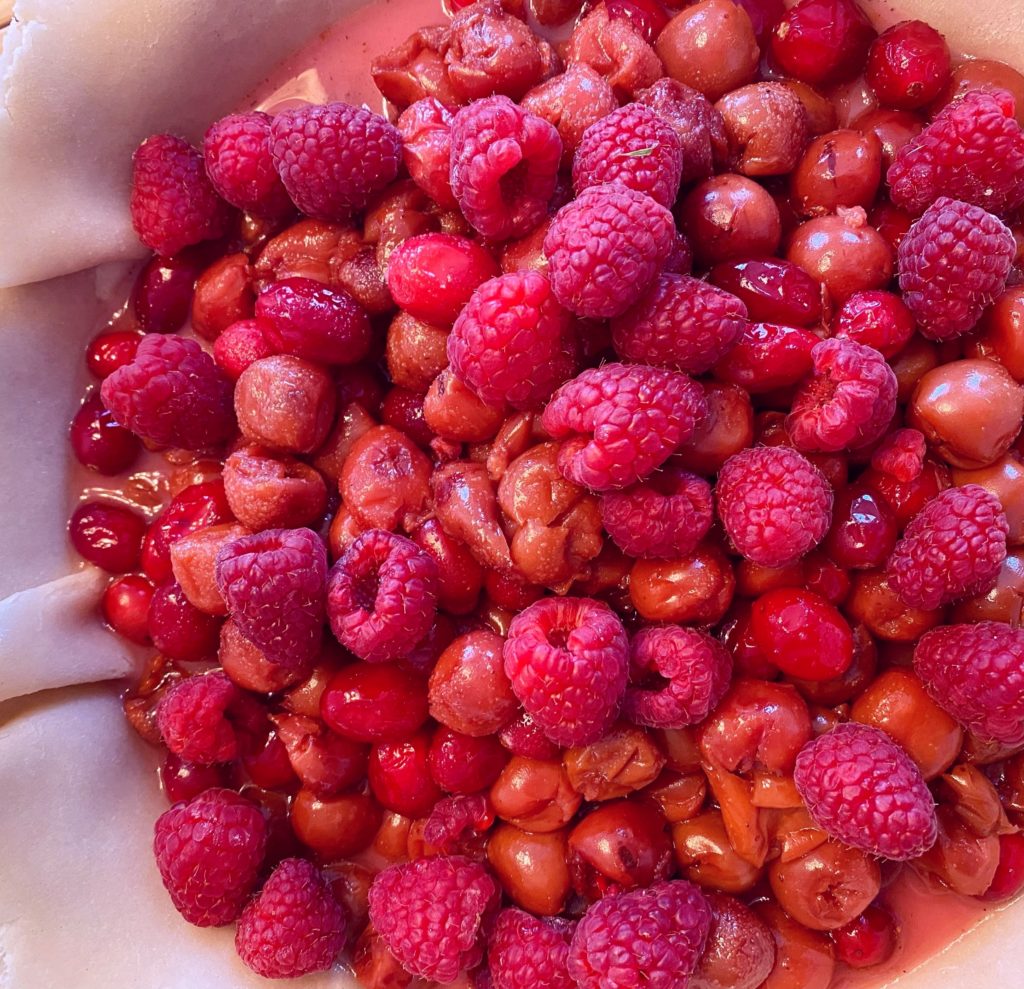 Adding Raspberries to the Cherry Cranberry Filling.