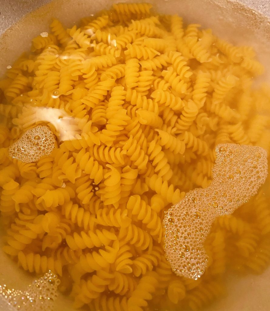 Pasta cooking in boiling water.
