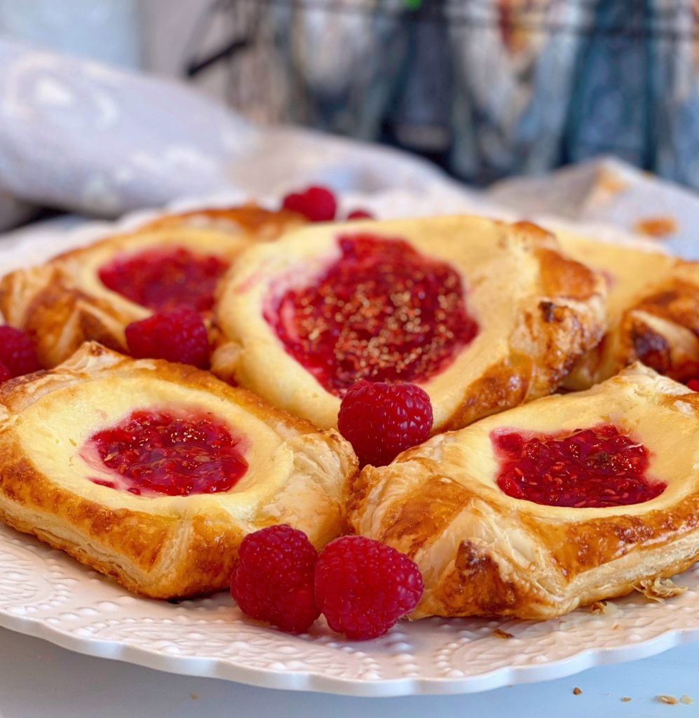 Plate full of Raspberry Cream Danishes.