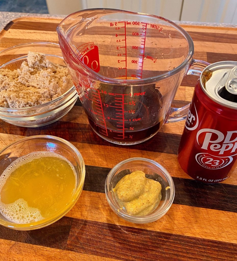 Ingredients for Dr Pepper Glaze measured out on a cutting board.