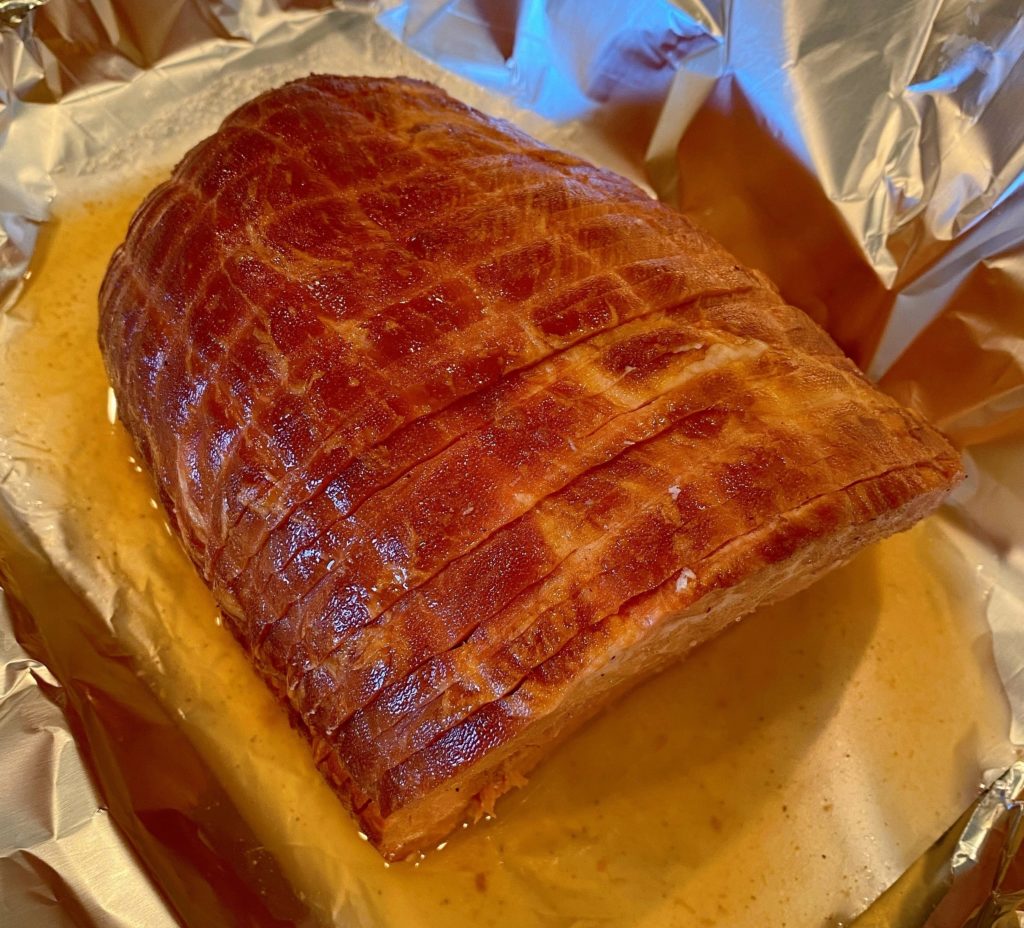 Ham in baking dish ready to bake.