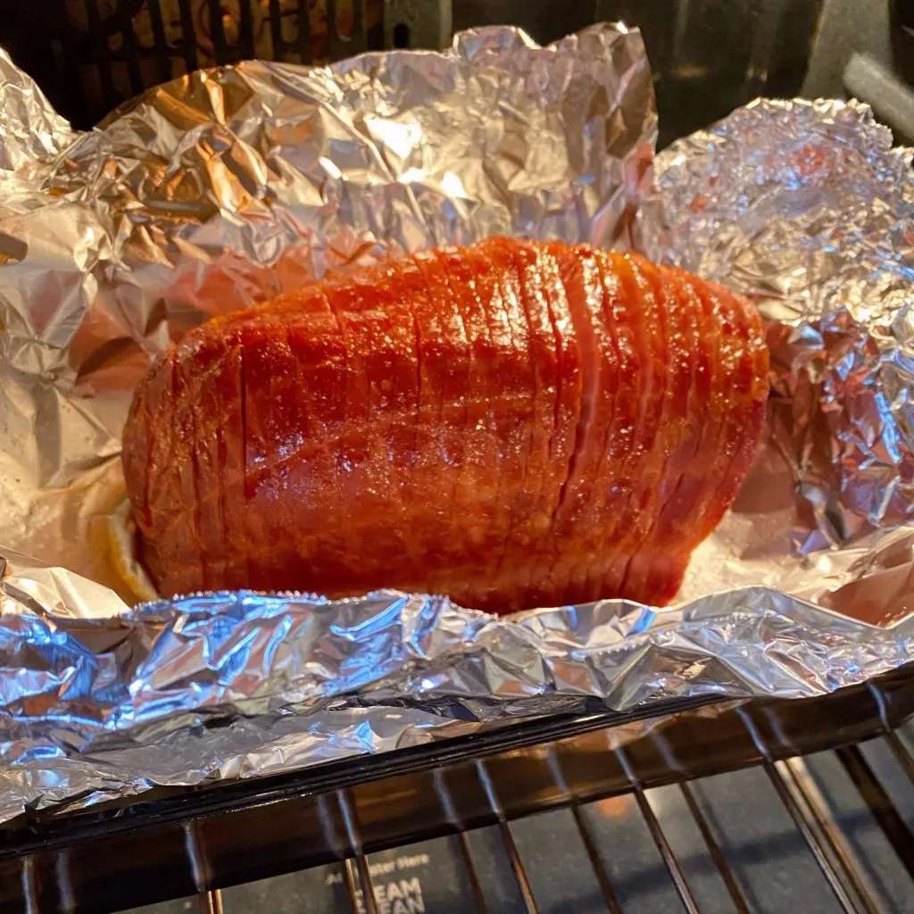Ham back in the oven, uncovered, and brushed with glazed.