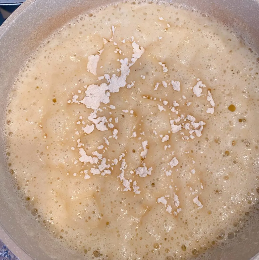 Adding flour and salt to melted butter. 