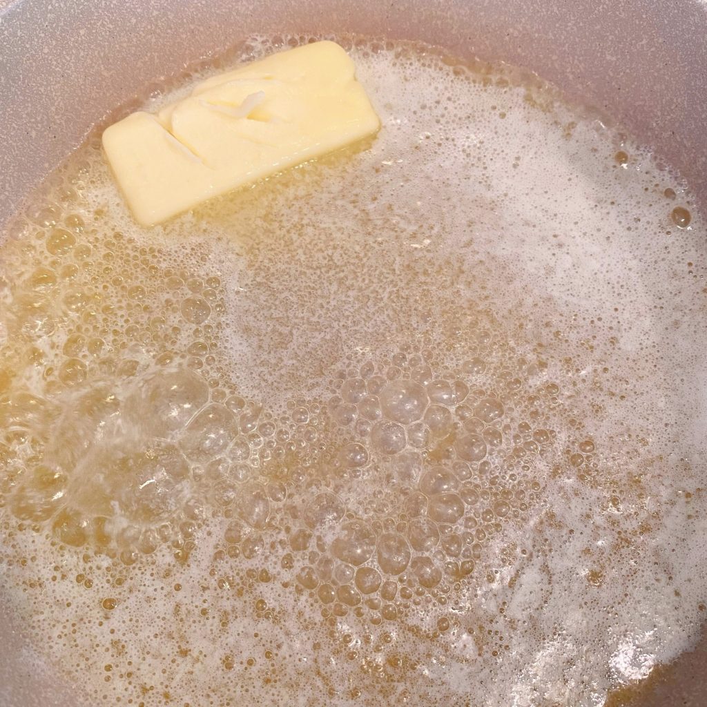 Butter melting in a skillet.