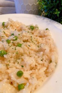 Oven Baked Parmesan Risotto in a white serving bowl.