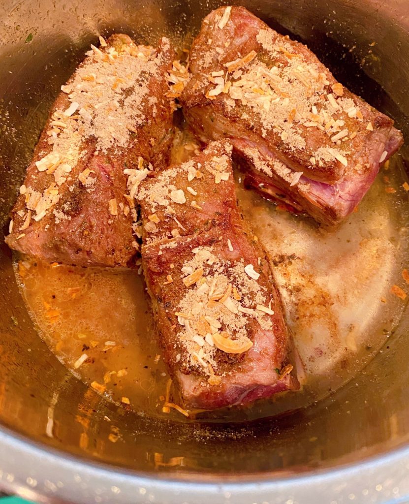 Ribs sprinkled with Onion Soup and 1/2 cup of water in the instant pot.l