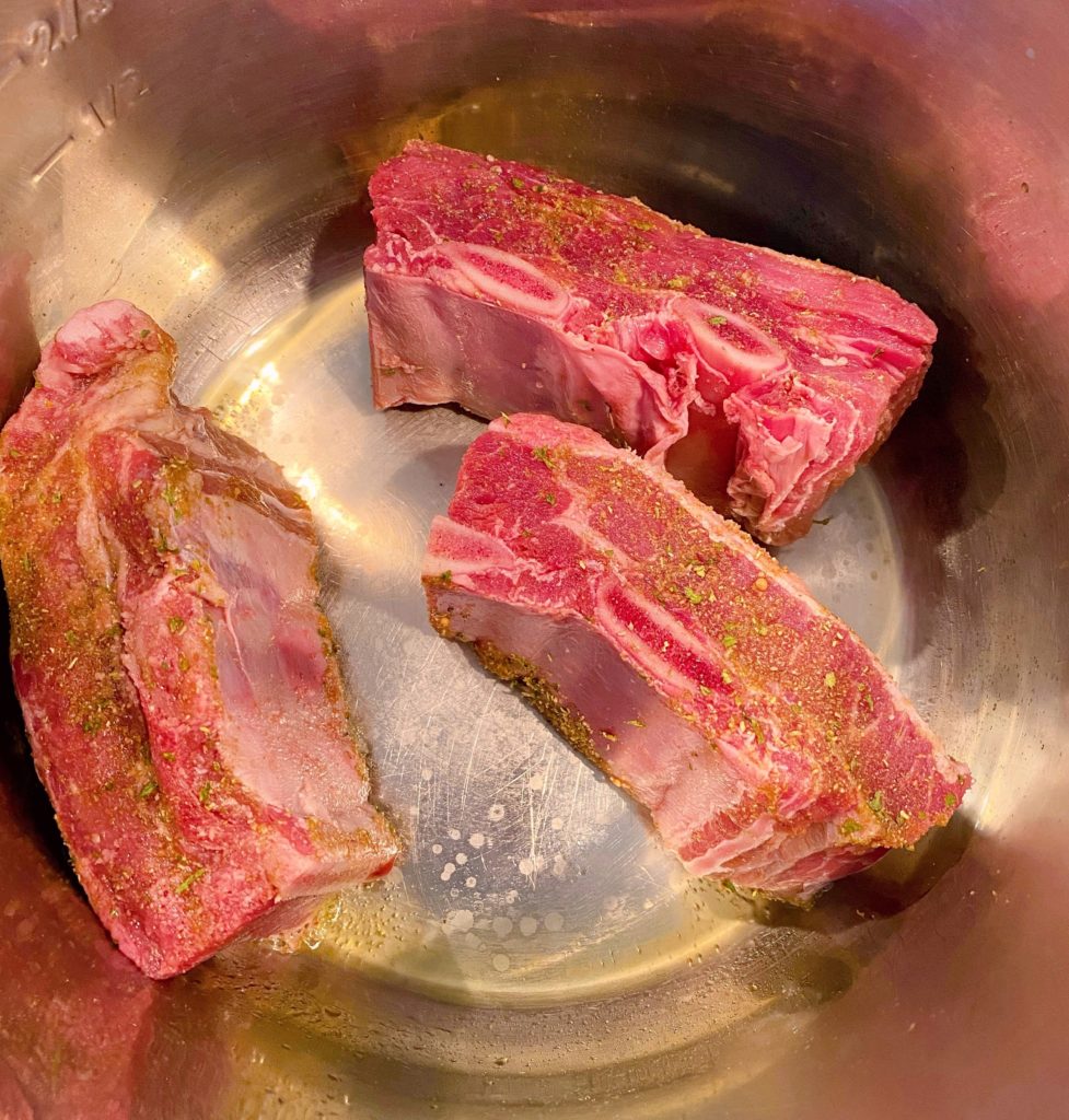 Ribs in hot Instant Pot Braising.