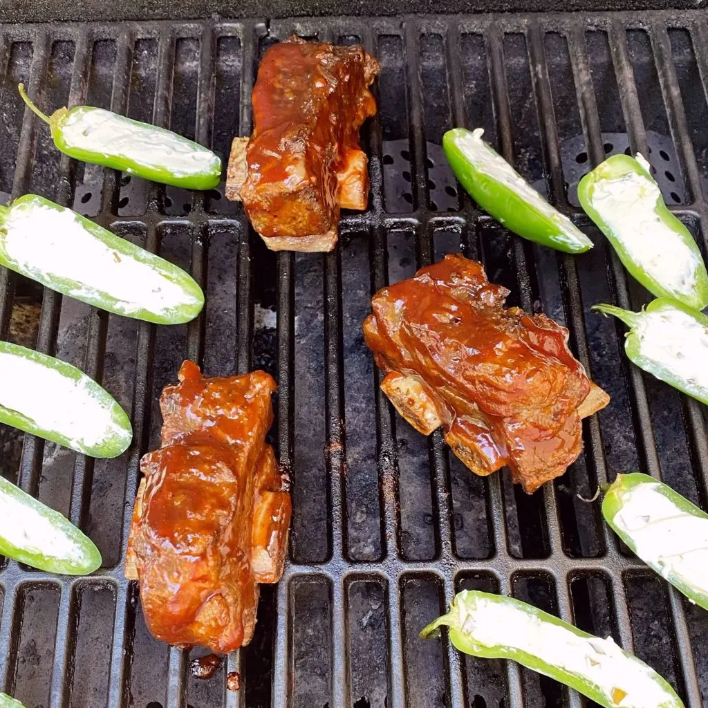 Ribs on the grill getting charred. 