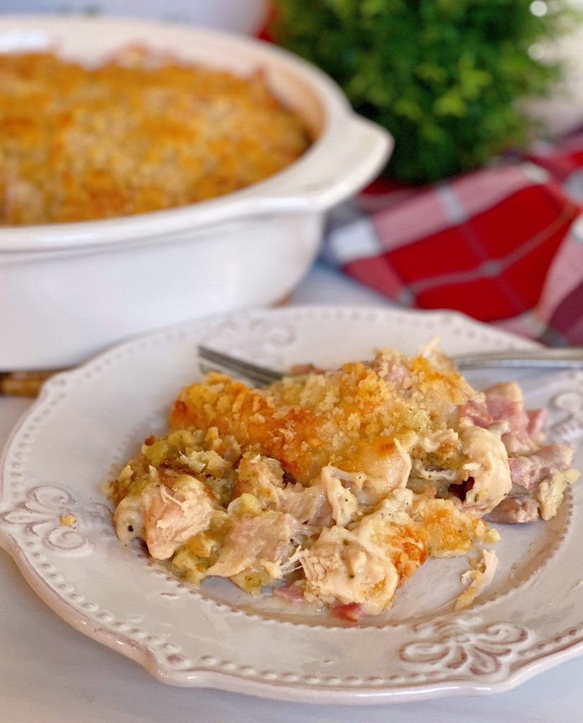 Baked Chicken Cordon Bleu Casserole with a serving on a white plate.