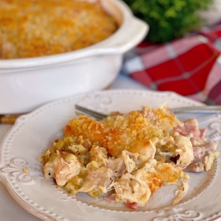 Baked Chicken Cordon Bleu Casserole with a serving on a white plate.