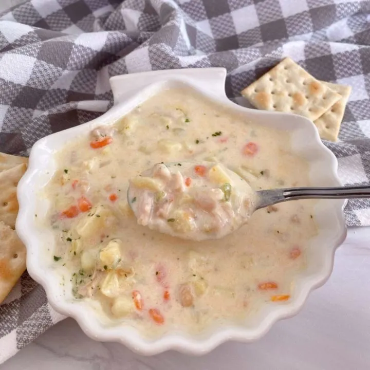 Clam Chowder in a shell shaped bowl.