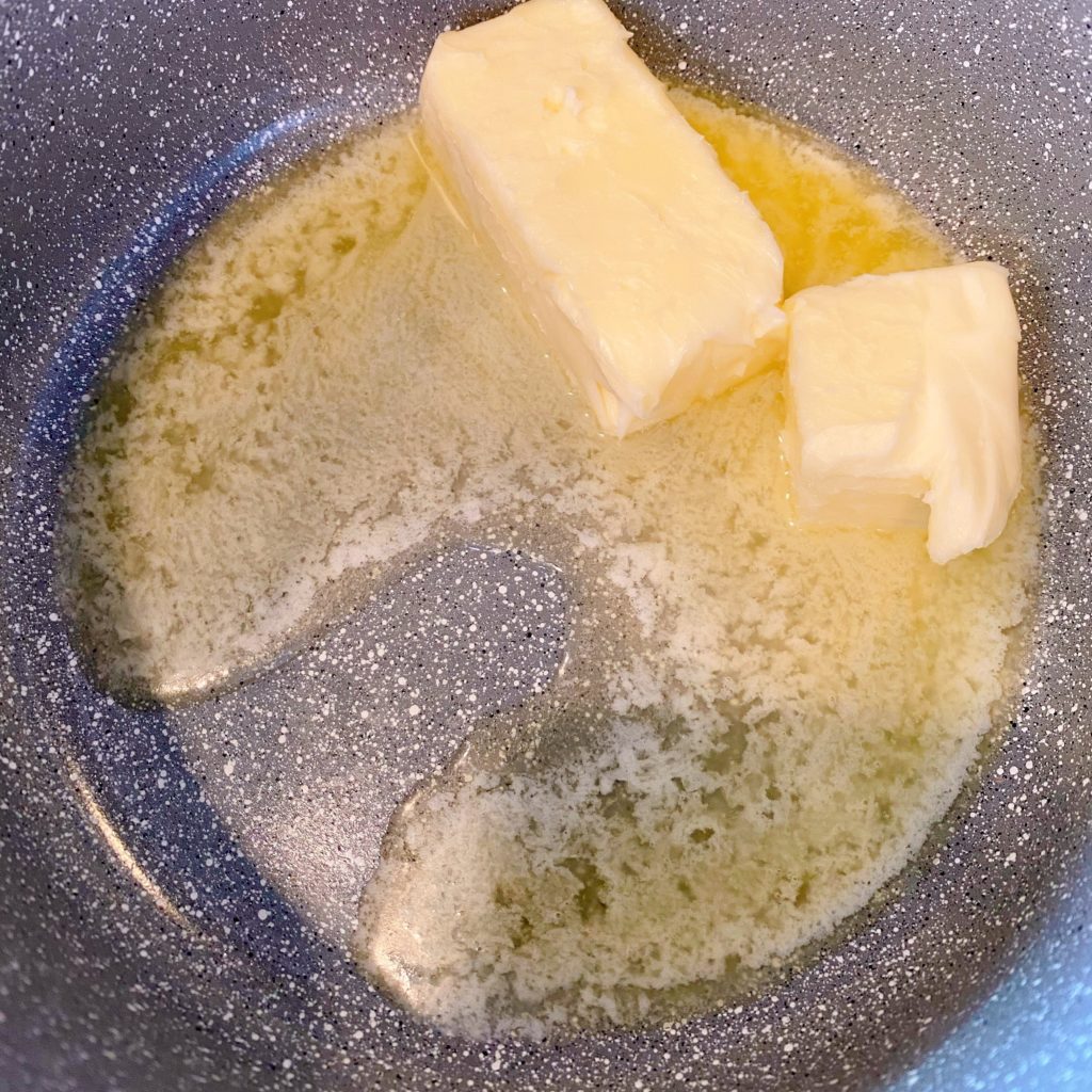 Butter melting in a heavy sauce pan.