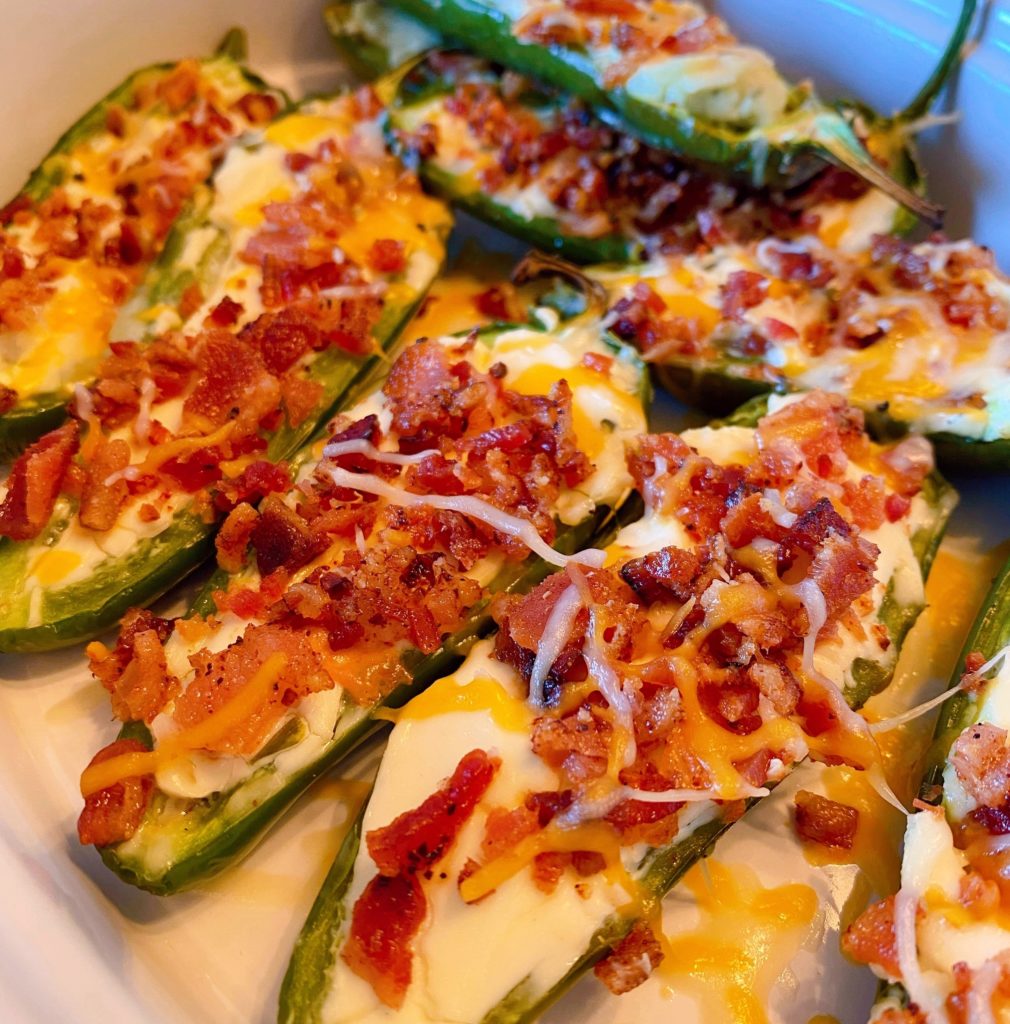 Stuffed Grilled Jalapeno Poppers in a white serving dish.