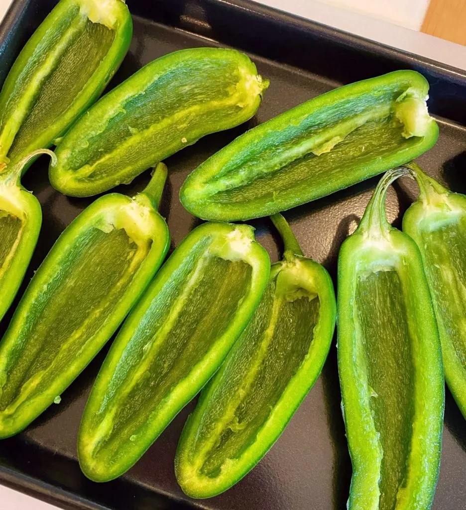 Jalapeno Peppers scraped clean and placed on a baking sheet.