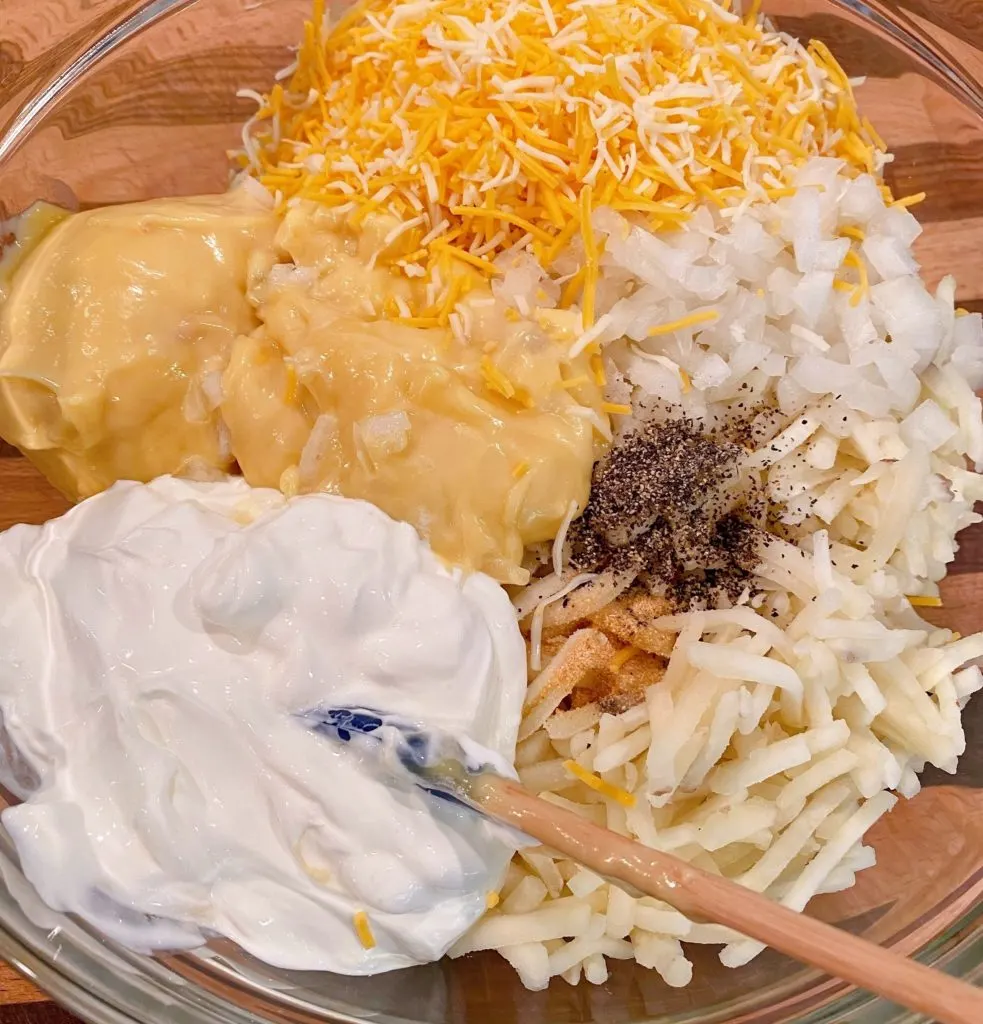 Cheesy Hash Brown soup mixture in glass bowl.