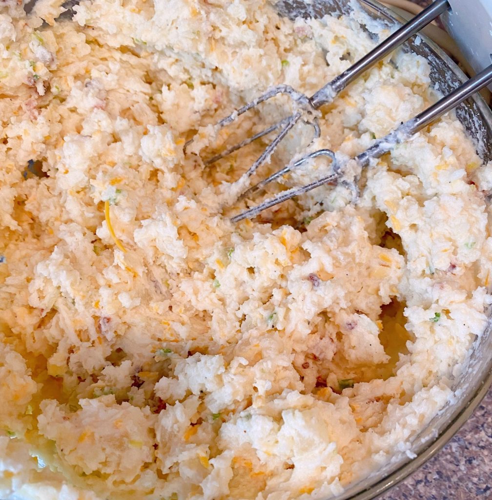 Potato Filling with mixer beaters to show how creamy they should be before stuffing into potatoes.