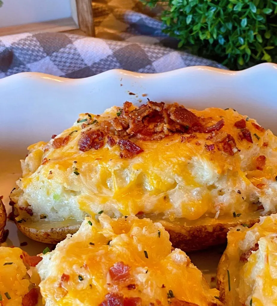 Twice Baked Potato up close in casserole dish. 