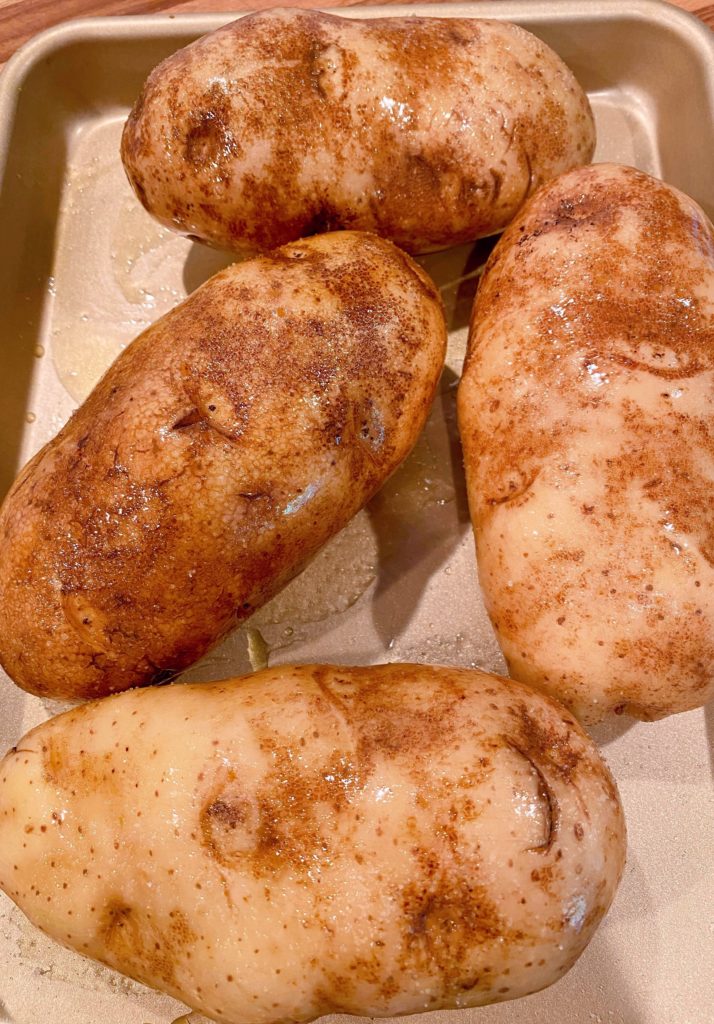 Potatoes ready to go in the oven. Salted, oiled, and ready to bake.