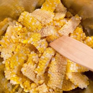 Adding Corn to hot instant pot to saute for 5 minutes.