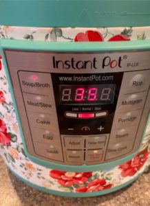 Front of instant pot with soup button selected and 35 minute cook time showing.