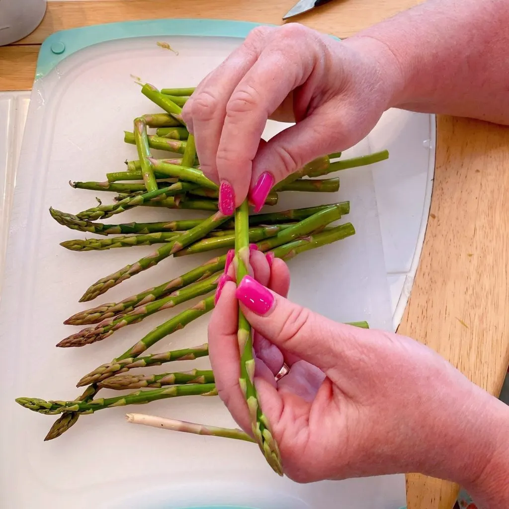 Bending the Asparagus to snap where most tender.