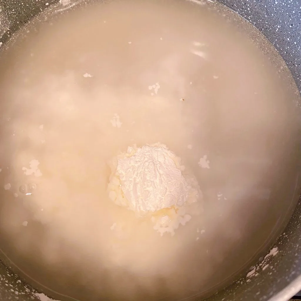 Sugar, water, and cornstarch in a medium pan over medium heat.
