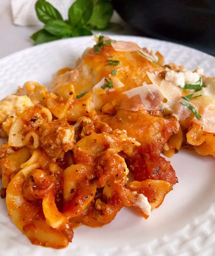 Close up serving of Skillet Lasagna on a white dinner plate.