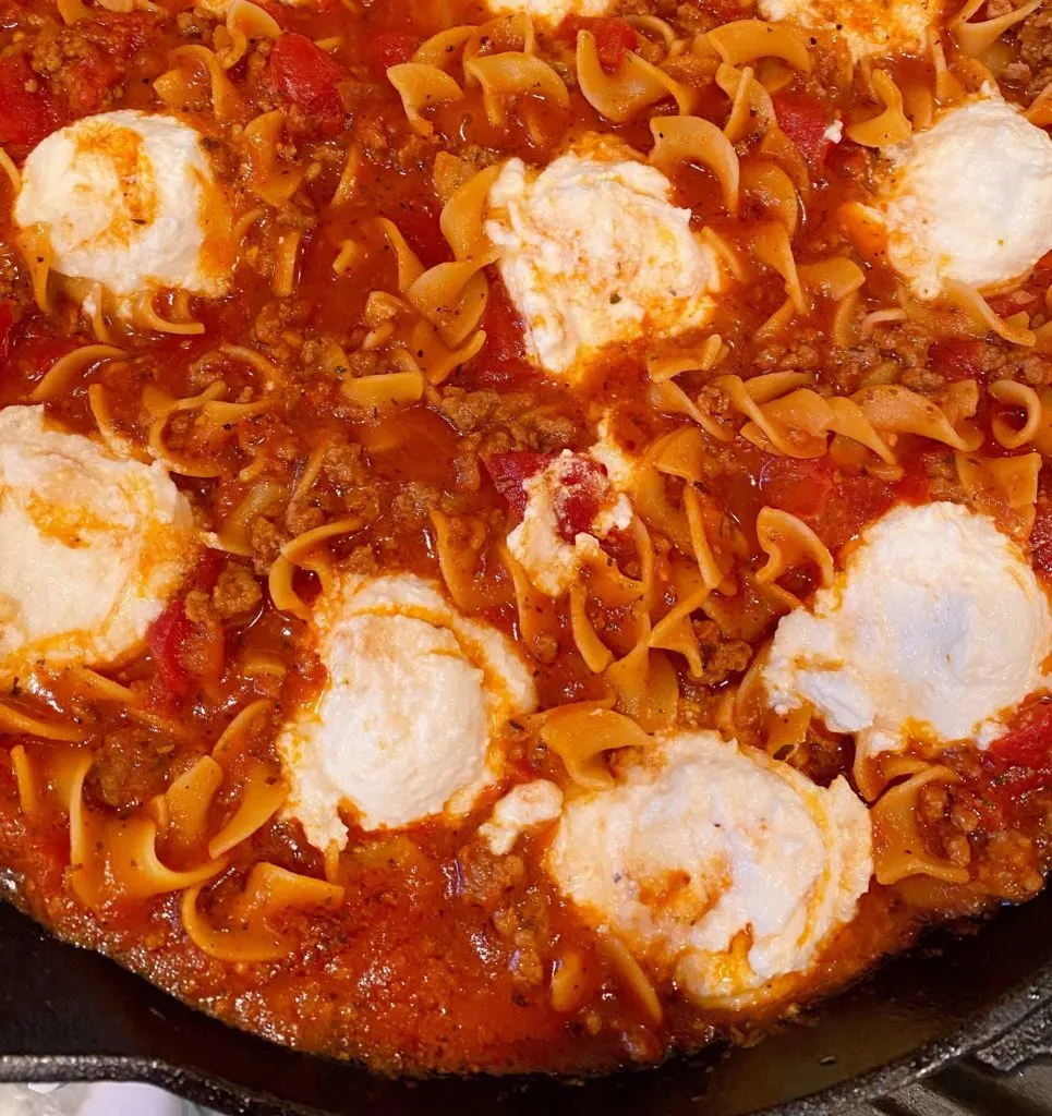 Skillet Lasagna with ricotta cheese added to the dish.