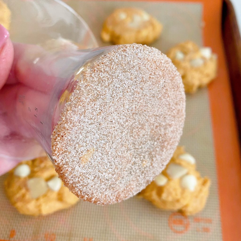 Glass bottom coated with cinnamon sugar to press the top of each cookie.