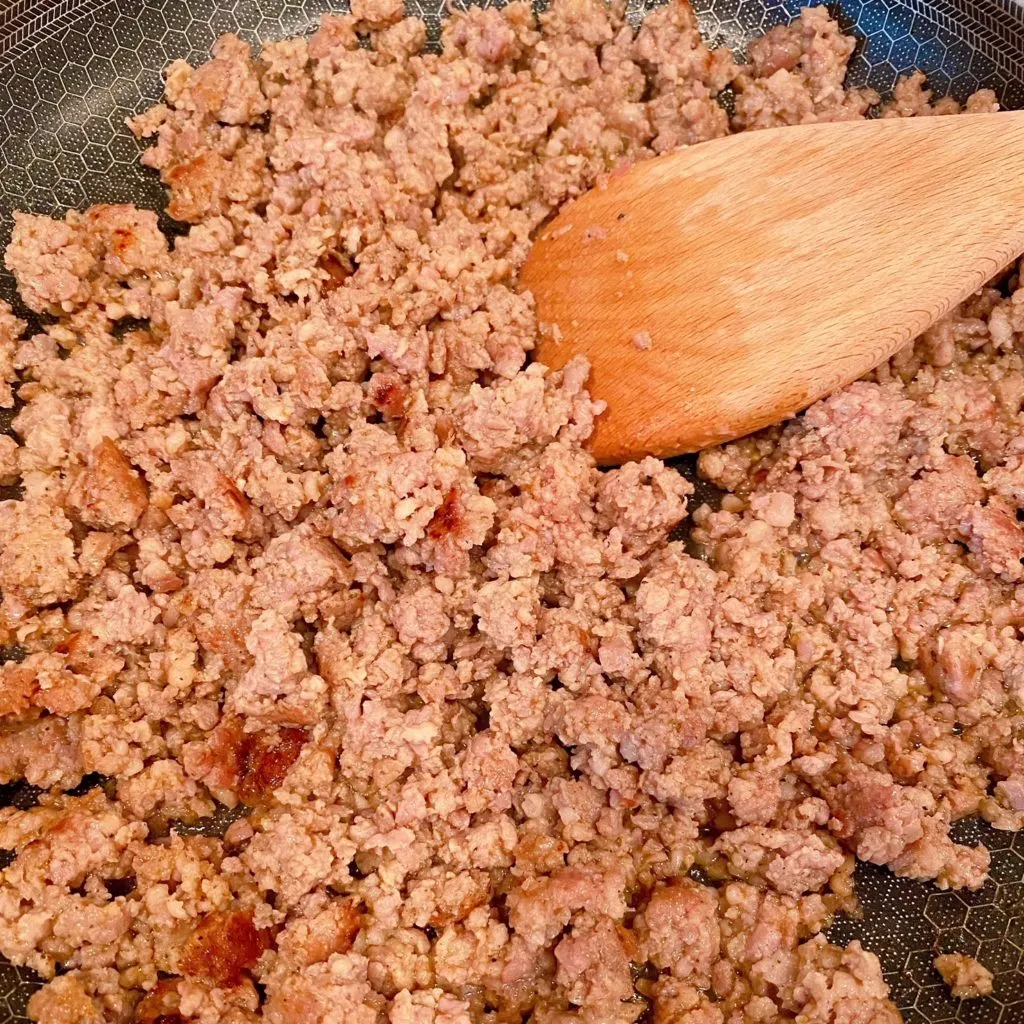 Browning Sausage in a large skillet over medium heat.
