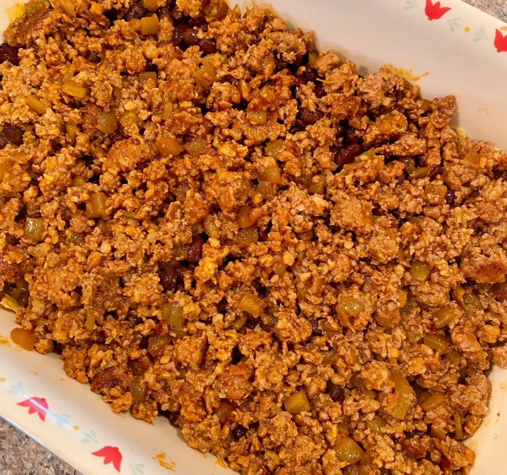 Meat Mixture on top of bean in casserole dish.