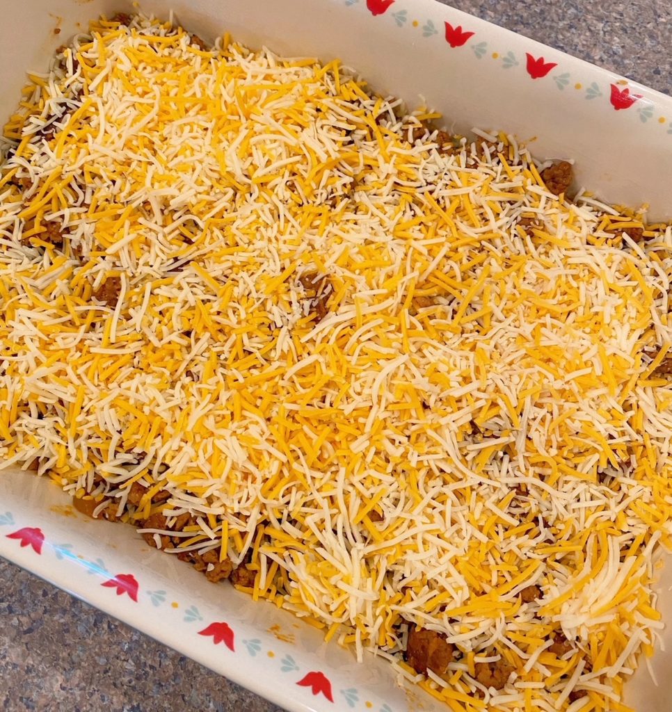Shredded Cheese on top of meat mixture.
