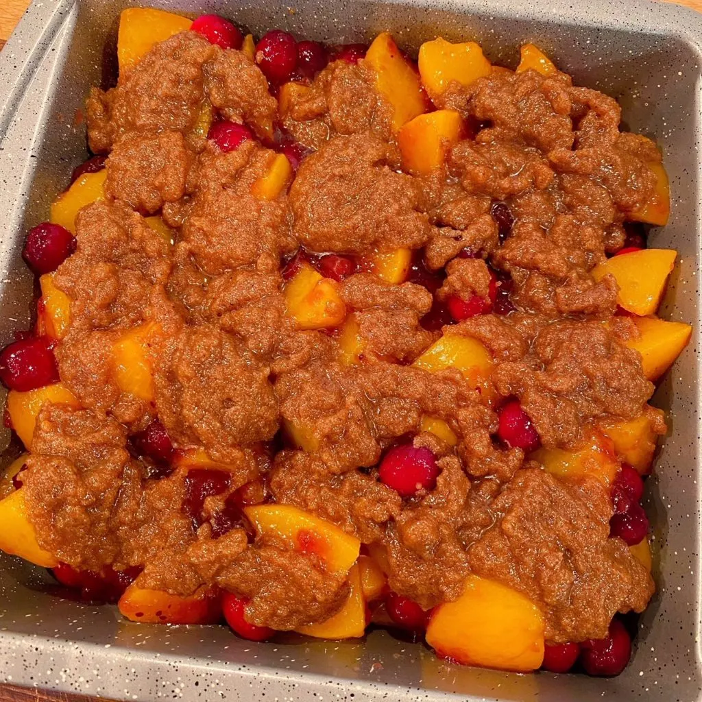 Cinnamon Topping added to peaches and cranberry filling.