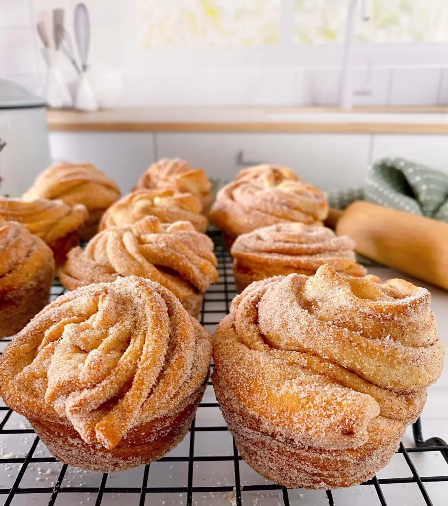 Cruffins on a baking pan.