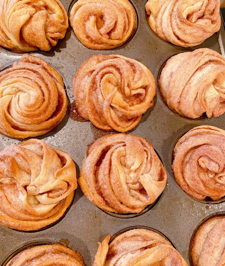 Baked Cruffins fresh out of the oven in the muffin tin.