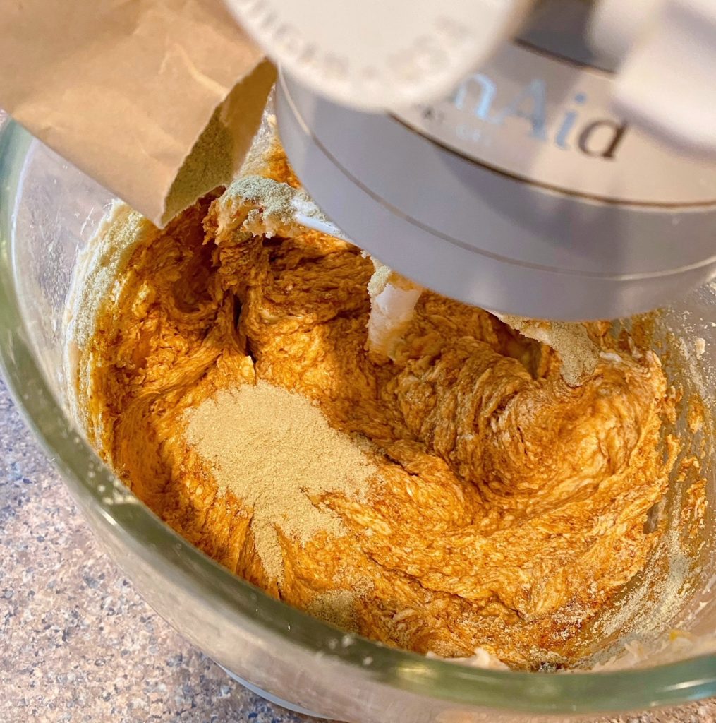 Adding Pudding to Sugar and Butter in the mixing bowl.