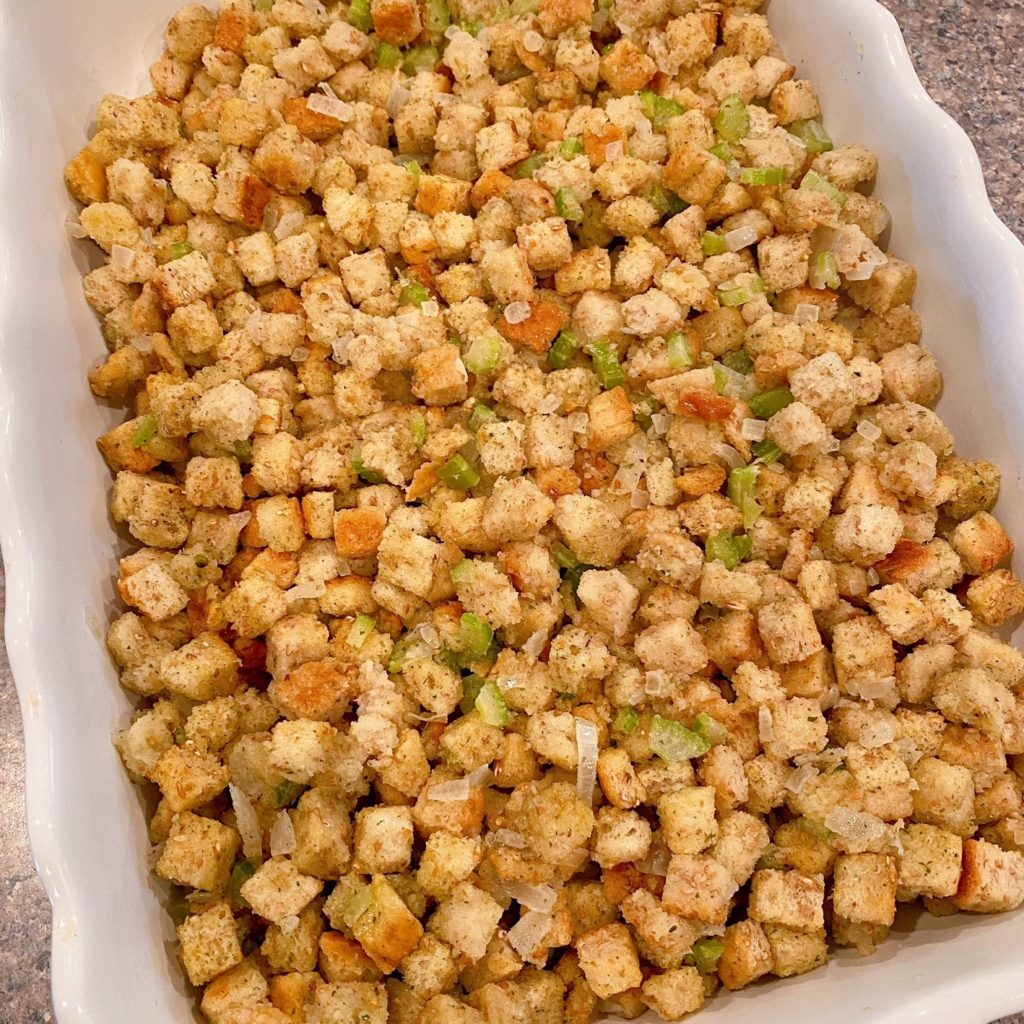 Stuffing mix spread into casserole dish.