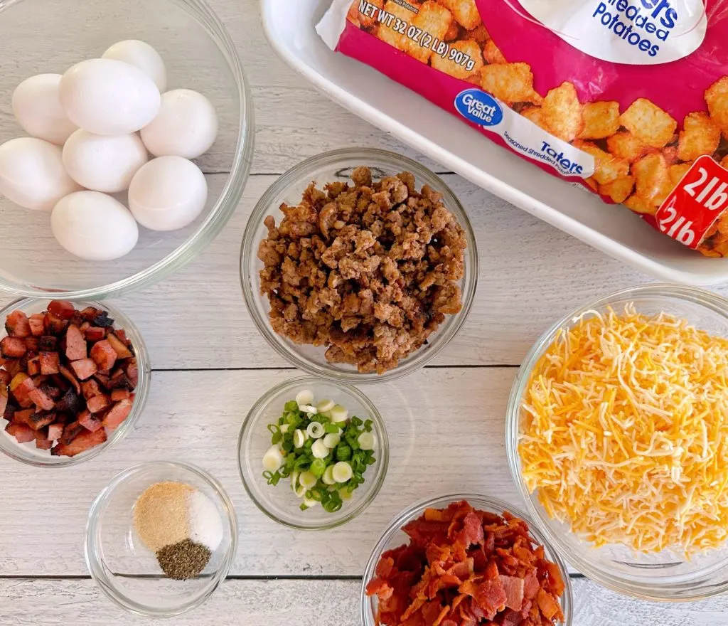 Ingredients for Tater Tot Breakfast Casserole  on a white board.