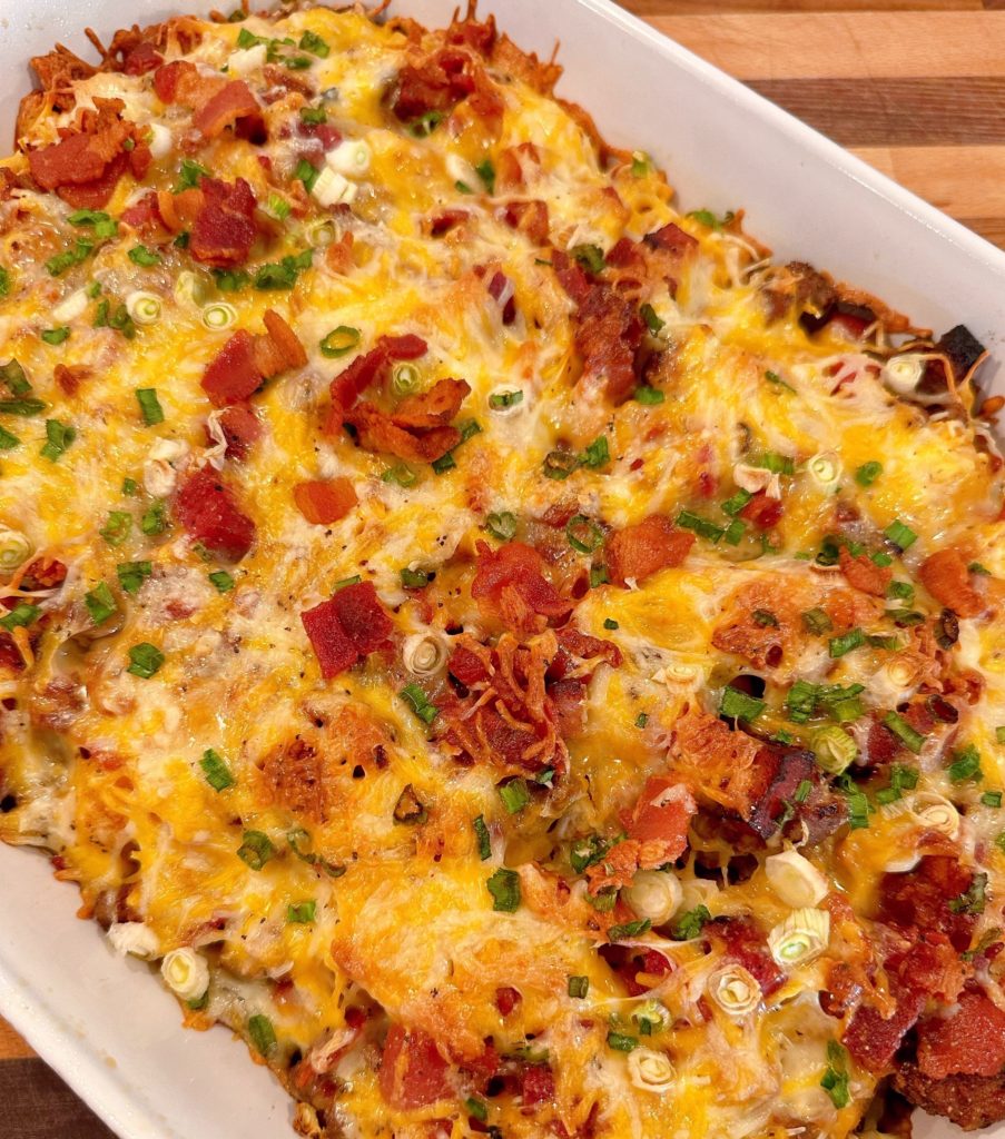 Baked Loaded Tater Tot Breakfast Casserole in baking dish fresh out of the oven.
