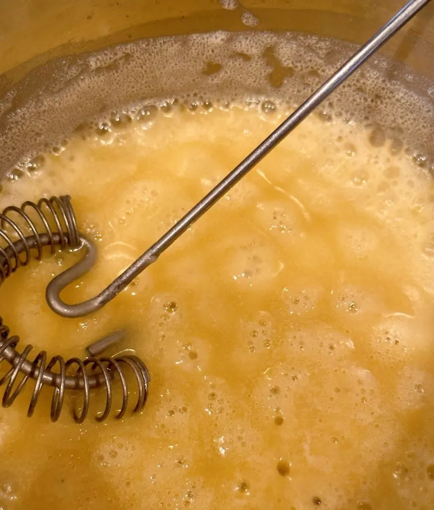 Roux in a small sauce pan with a wire whisk.
