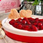 Bowl full of Cherries on a Cloud Fruit dip with two Pie Pastry Hearts.