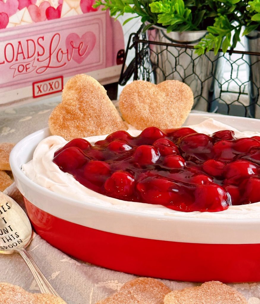Bowl full of Cherries on a Cloud Fruit dip with two Pie Pastry Hearts.